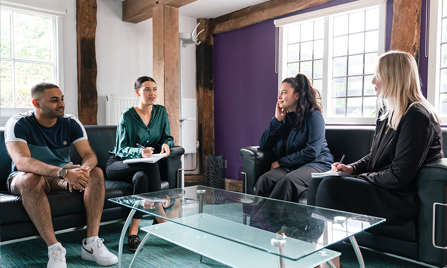 A group of women and one man at work