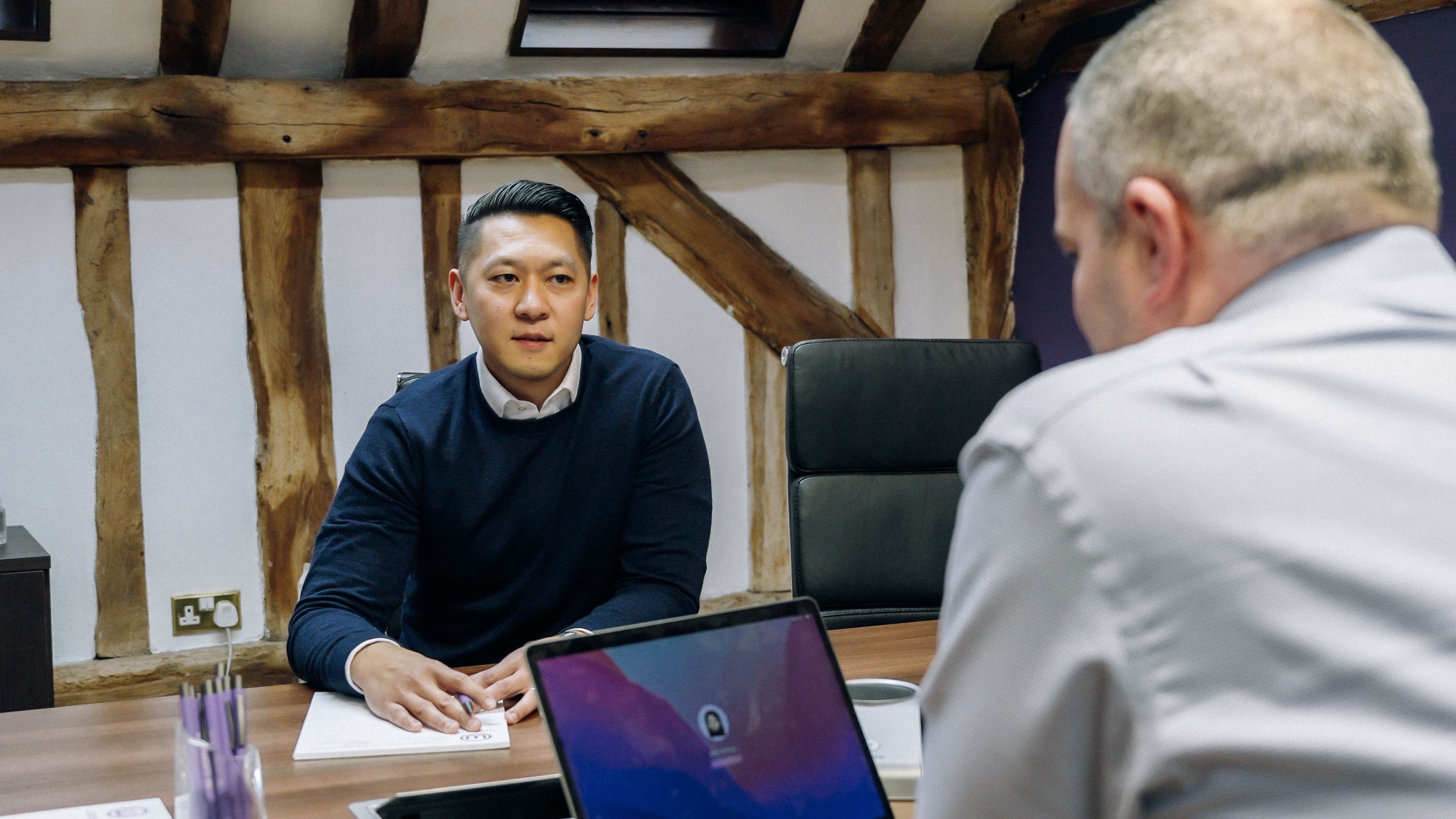 Two employees are discussing work