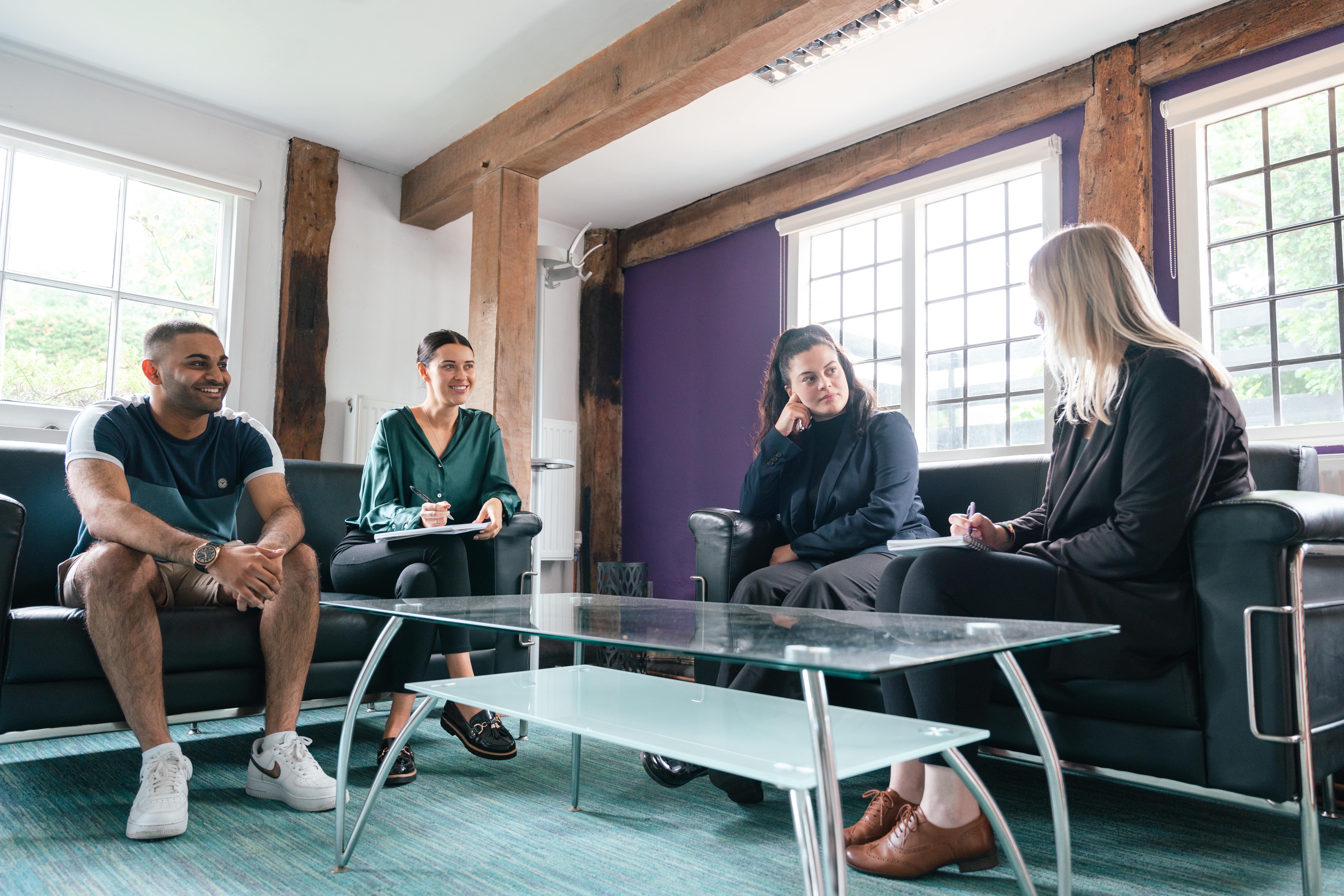 4 employees discussing work