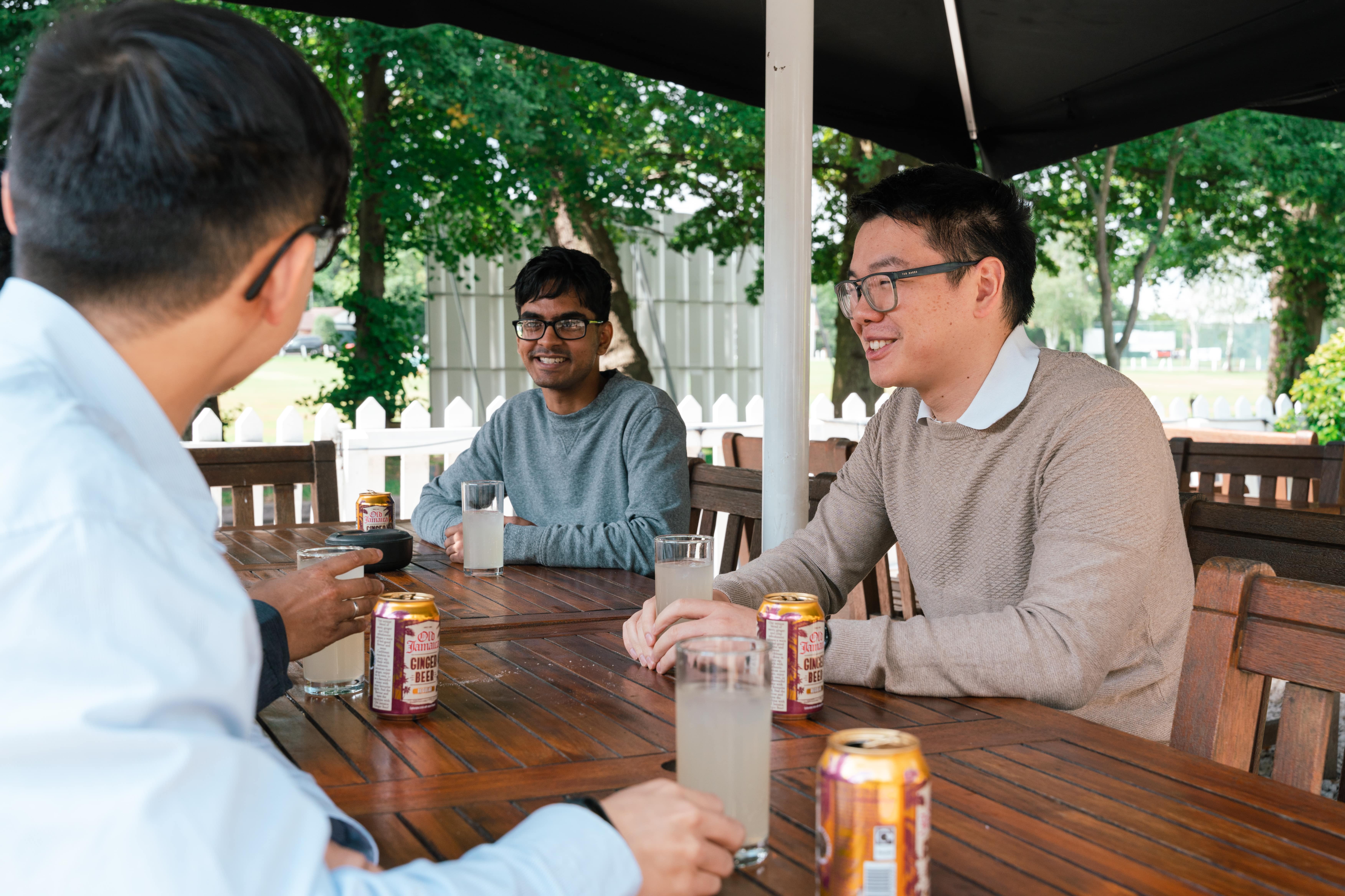 3 employees relaxing and drinking lemonade